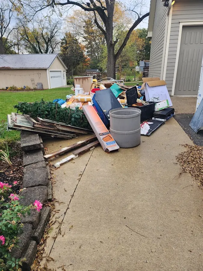 Dumpster being loaded with debris for Residential Dumpster Rental in Babylon